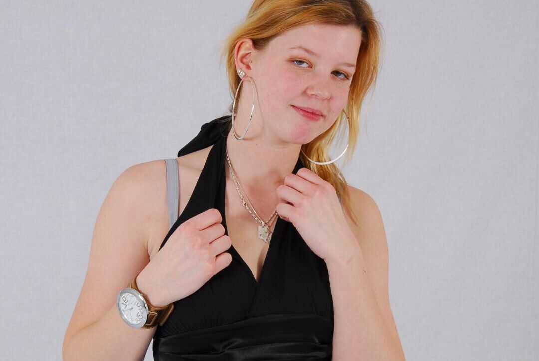 16P Kylie wearing her own Geneva huge cuff watch