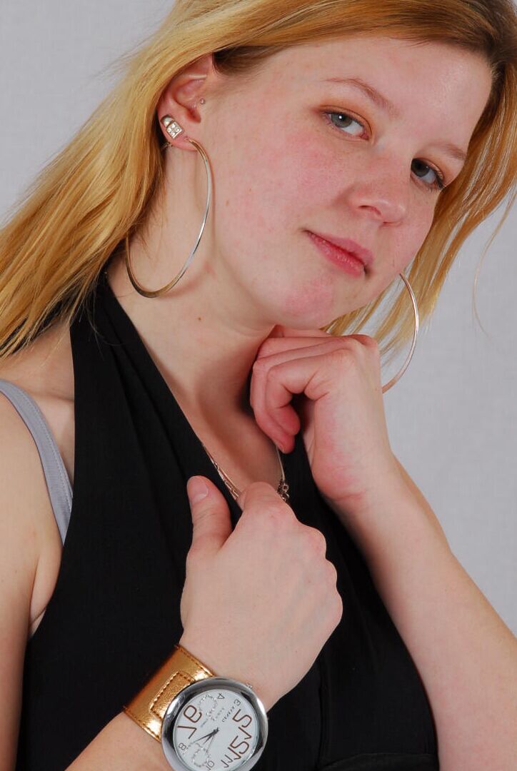 16P Kylie wearing her own Geneva huge cuff watch