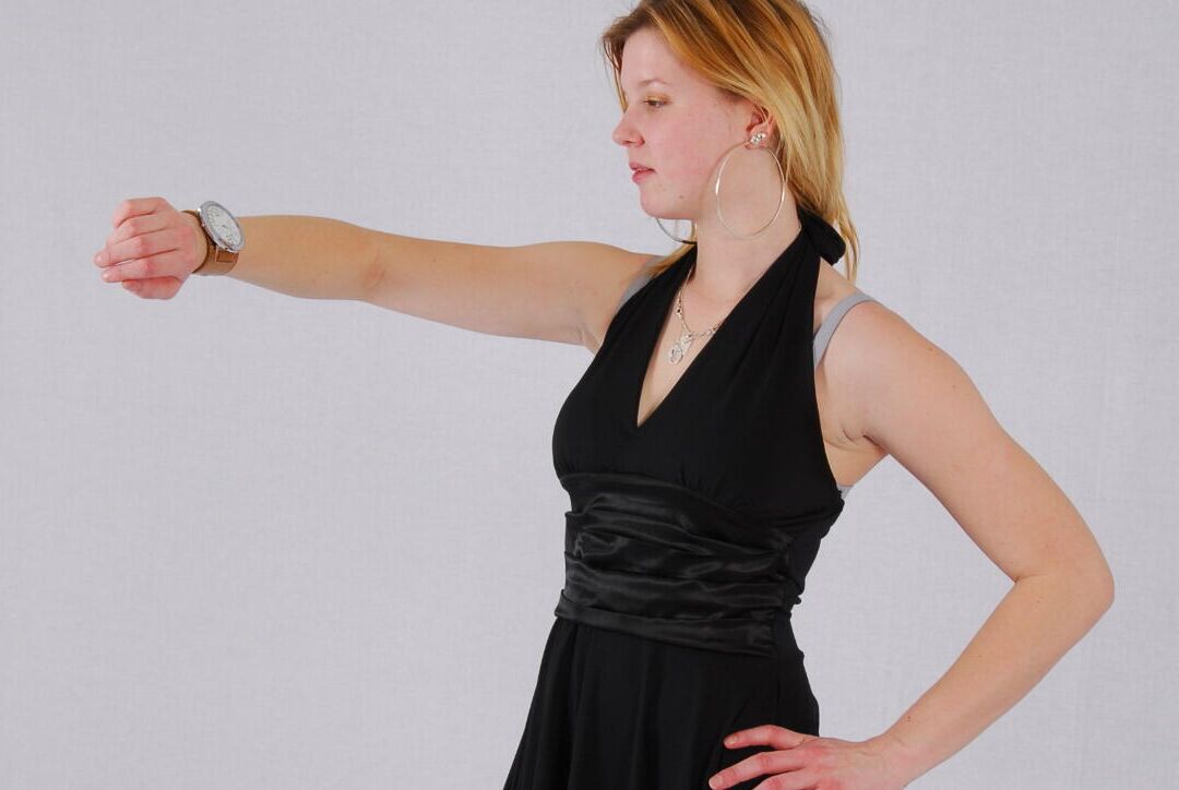 16P Kylie wearing her own Geneva huge cuff watch