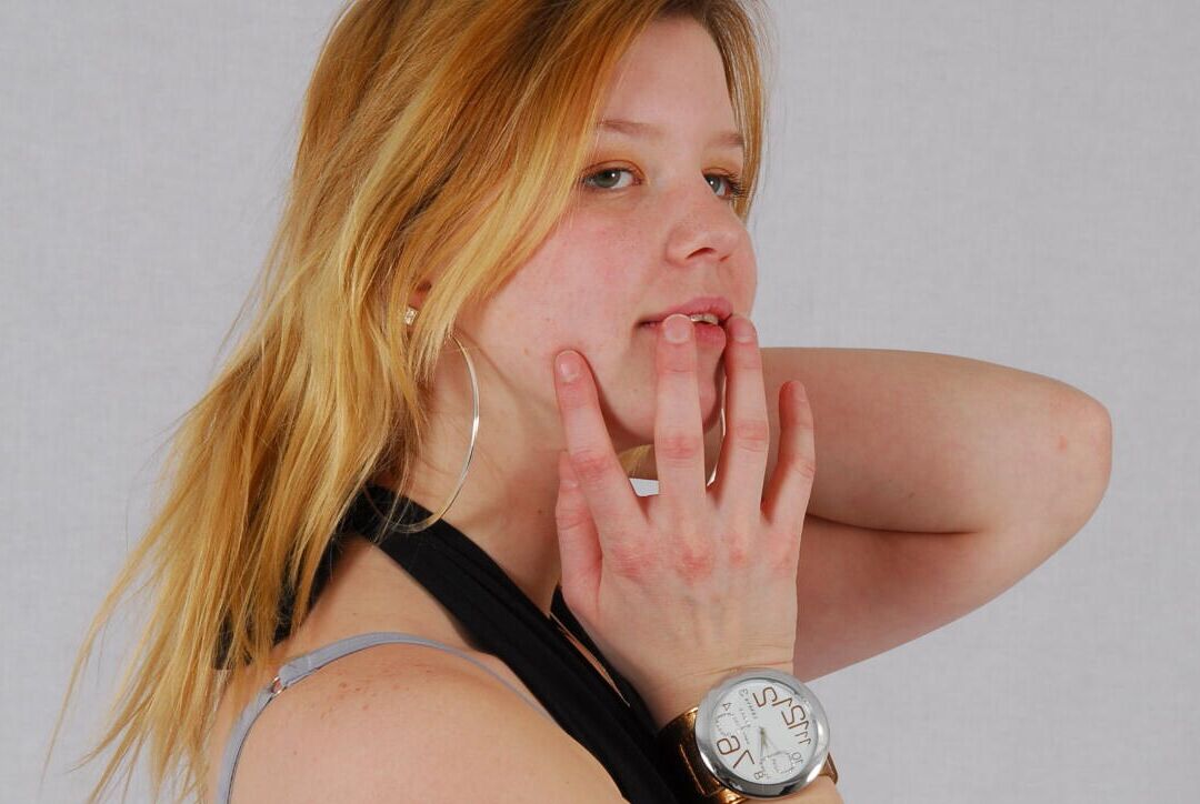 16P Kylie wearing her own Geneva huge cuff watch