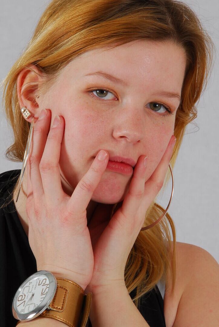 16P Kylie wearing her own Geneva huge cuff watch