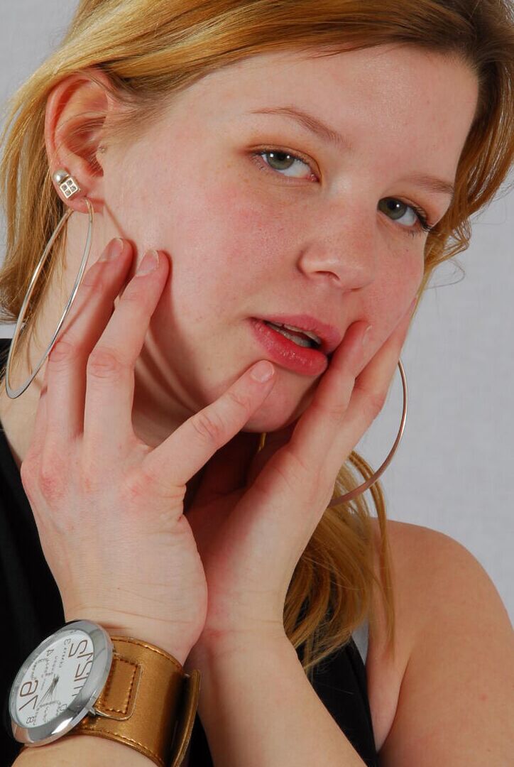 16P Kylie wearing her own Geneva huge cuff watch