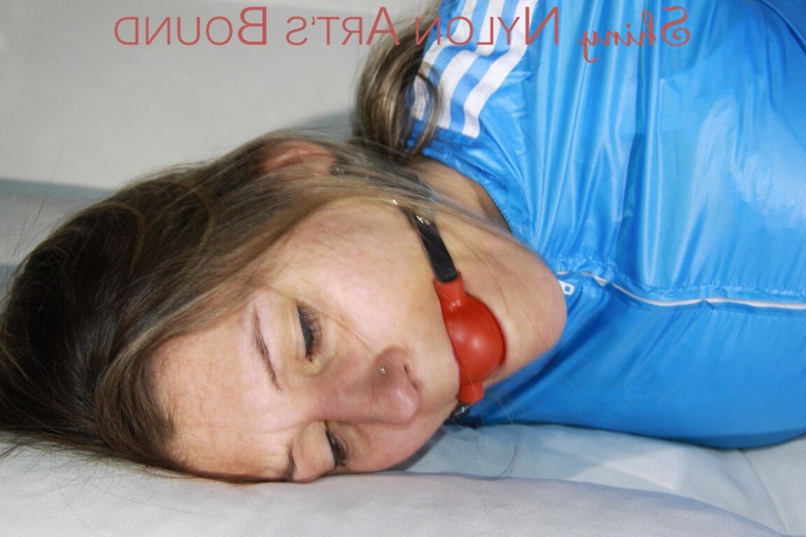 16P SEXY SANDRA being tied and gagged with ropes and a ballgag on a sofa wearing a