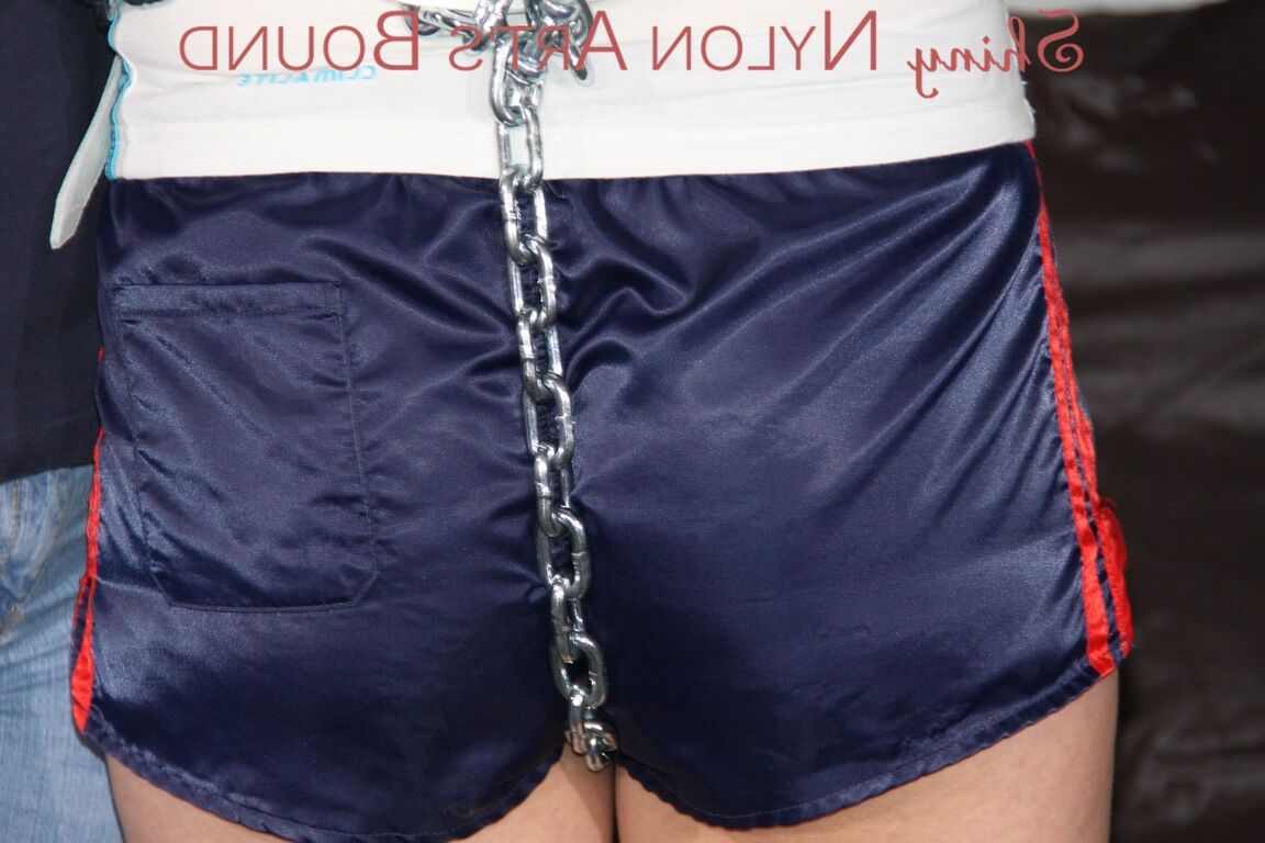 16P Sexy Pia tied and gagged overhead with chains, cuffs and a holster with a
