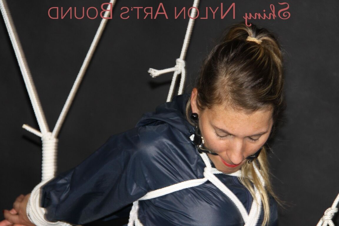 16P Sexy Sandra being tied and gagged overhead with ropes and a ballgag wearing a