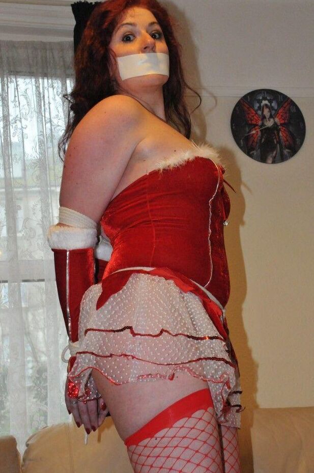 16P Redheaded solo girl shows her natural tits while restrained and gagged at Xmas