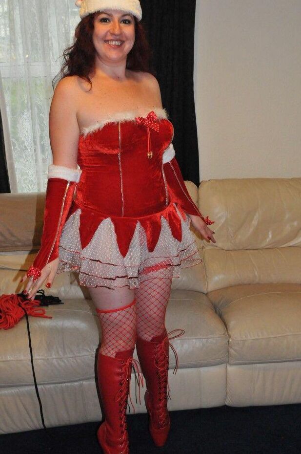 16P Redheaded solo girl shows her natural tits while restrained and gagged at Xmas