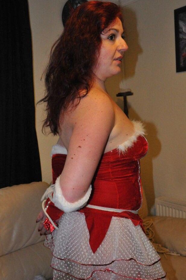 16P Redheaded solo girl shows her natural tits while restrained and gagged at Xmas