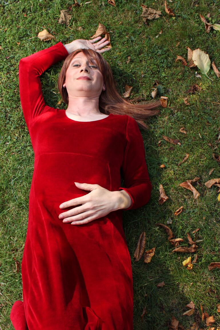 15P Lucimay posing outdoors in a gorgeous long red dress
