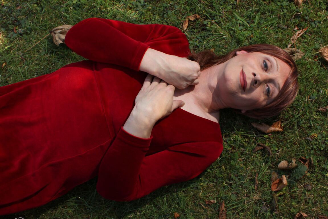 15P Lucimay posing outdoors in a gorgeous long red dress