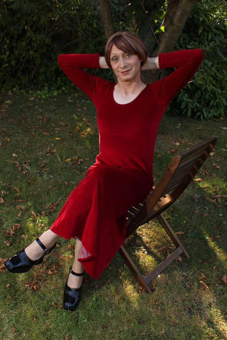 15P Lucimay posing outdoors in a gorgeous long red dress