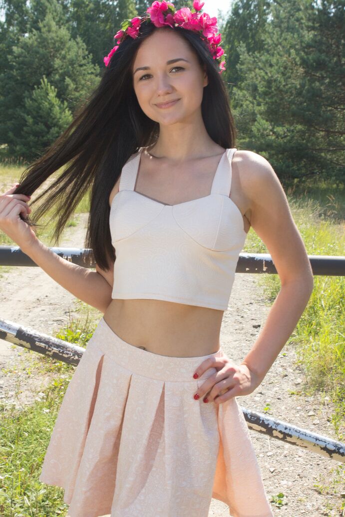 20P Young brunette Olivia wears a crown of flowers while exposing her clit