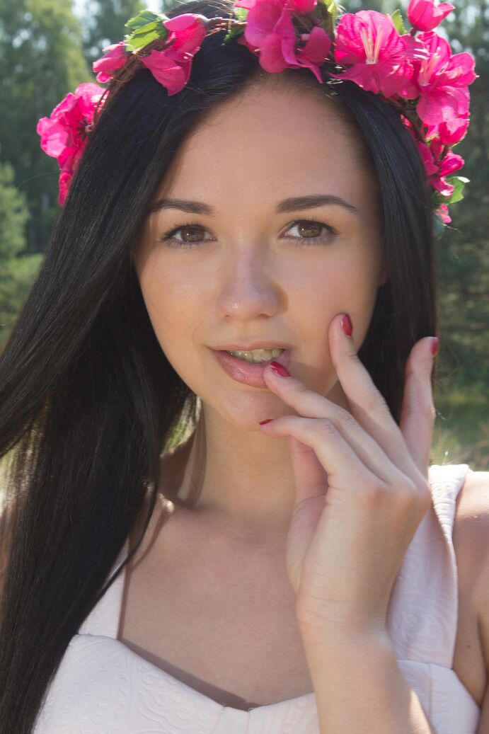 20P Young brunette Olivia wears a crown of flowers while exposing her clit