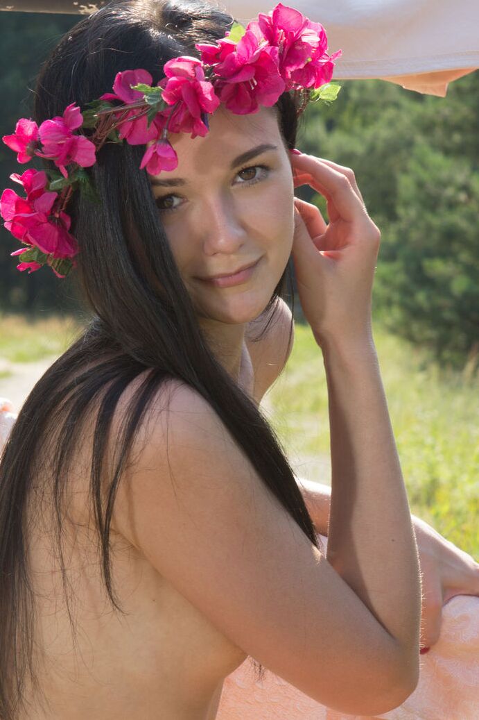 20P Young brunette Olivia wears a crown of flowers while exposing her clit