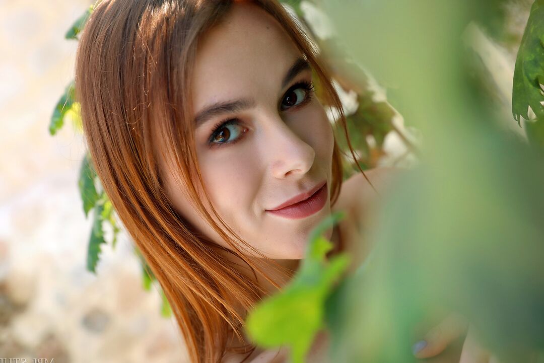 12P Slender redhead with a nice ass and tight slit poses nude by a pool