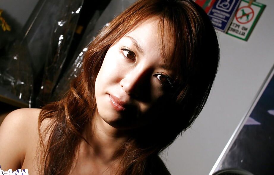 16P Alluring asian babe with tempting ass gets rid of her clothes