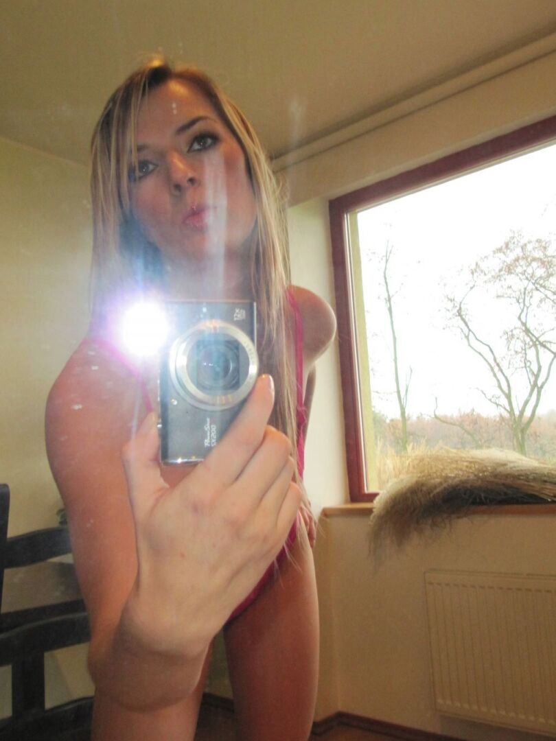 21P Amateur sweetie Leisha reveals her titties while posing in front of a mirror