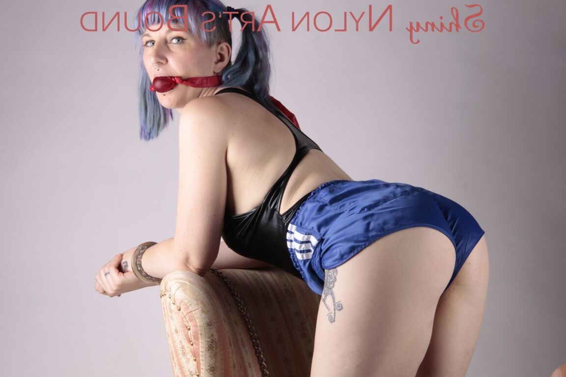 16P Mara ties and gagges herself with cuffs and a ball gag on an armchair wearing