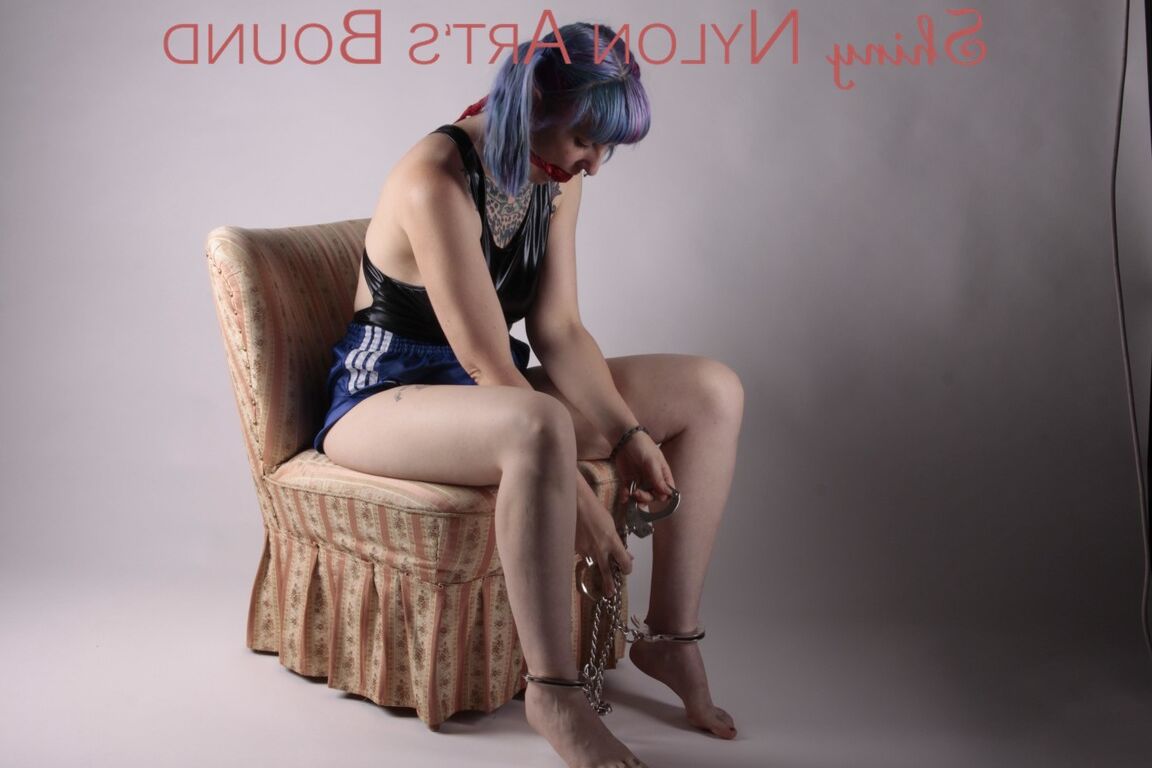 16P Mara ties and gagges herself with cuffs and a ball gag on an armchair wearing
