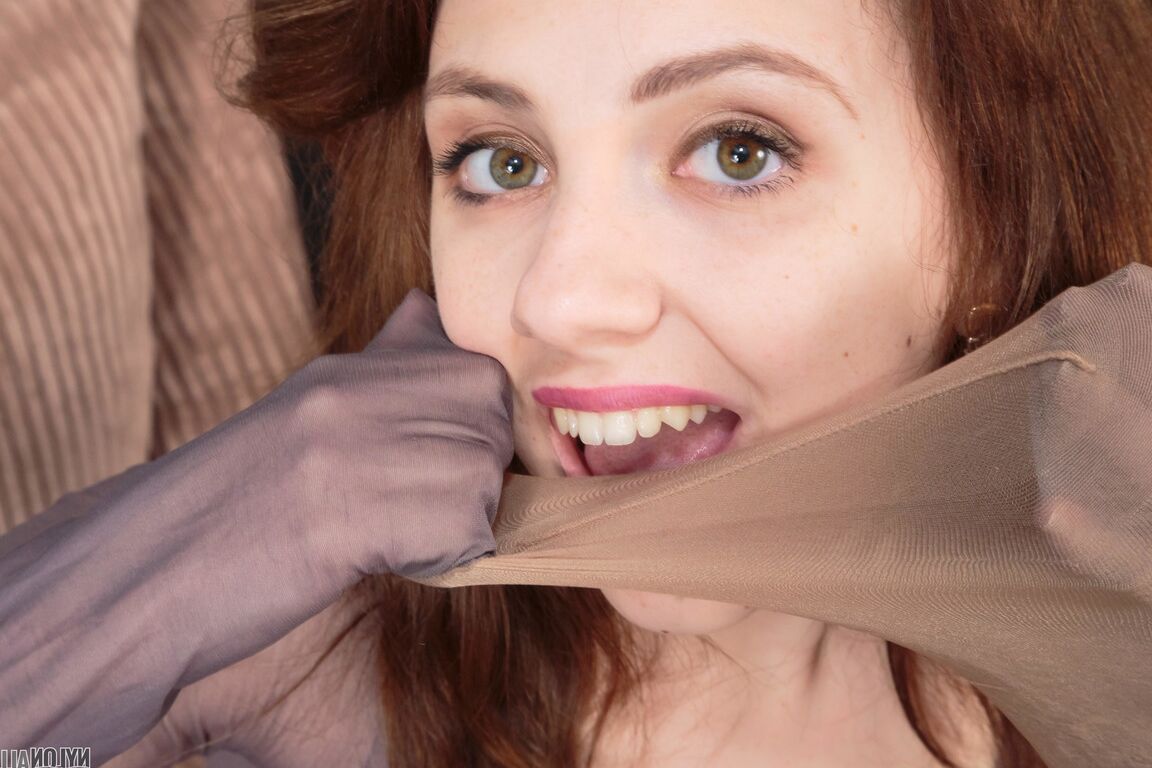 16P Pretty girl Mia adorns herself in layers of pantyhose and a strapon cock