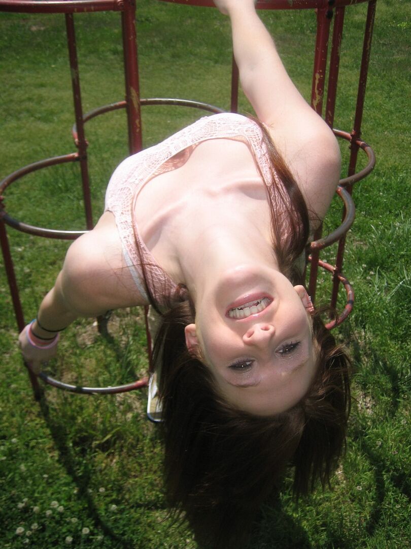 12P Cute ginger teen Ruby flashes her perky tits at the park while playing on the