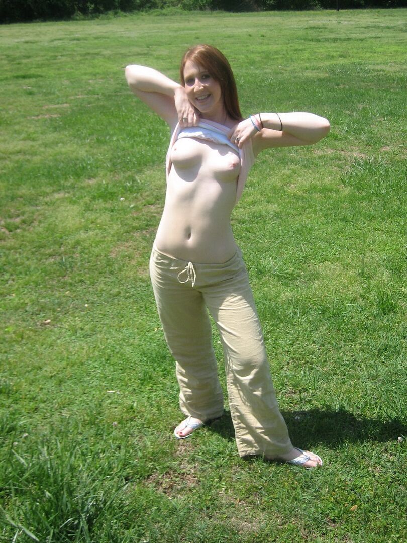 12P Cute ginger teen Ruby flashes her perky tits at the park while playing on the
