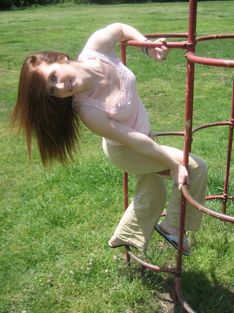12P Cute ginger teen Ruby flashes her perky tits at the park while playing on the