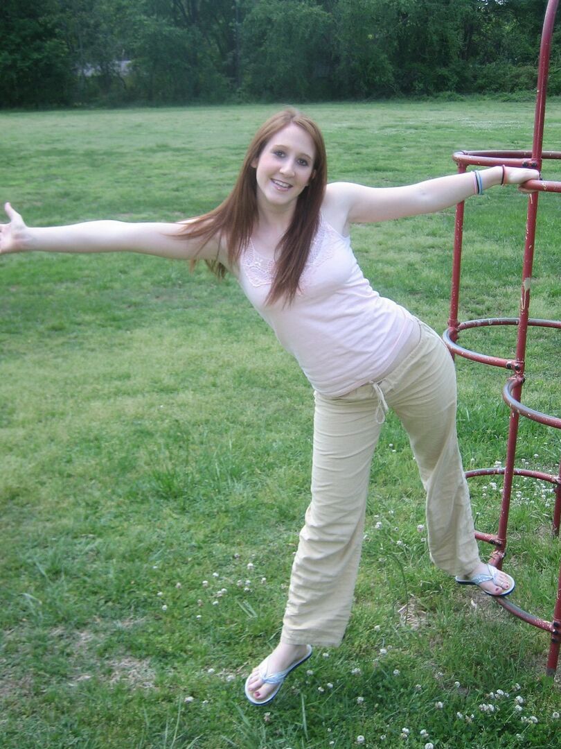12P Cute ginger teen Ruby flashes her perky tits at the park while playing on the