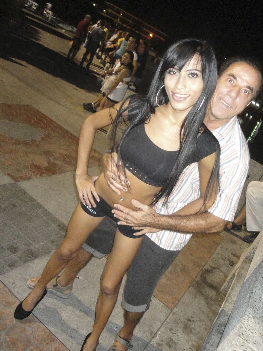 17P Pretty shemale brunette Fon sticking a lollipop in her tight butthole