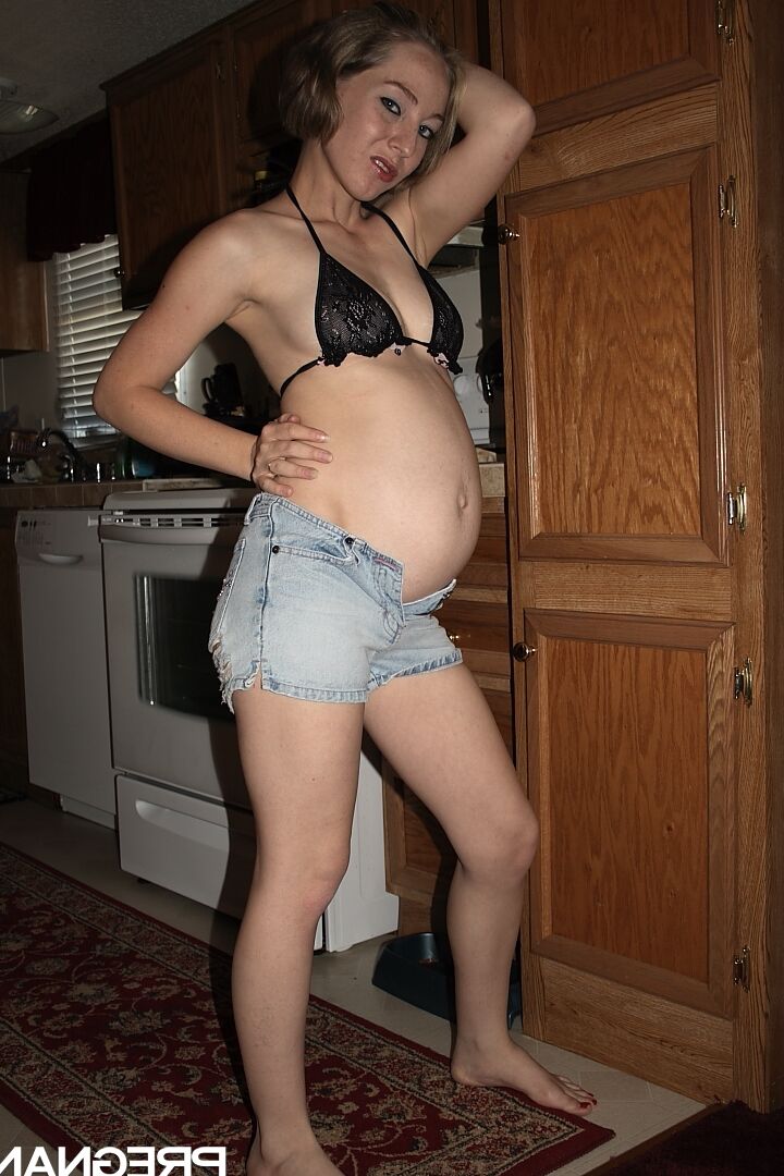 16P Heavily pregnant girl doffs bikini top and denim shorts to model totally naked