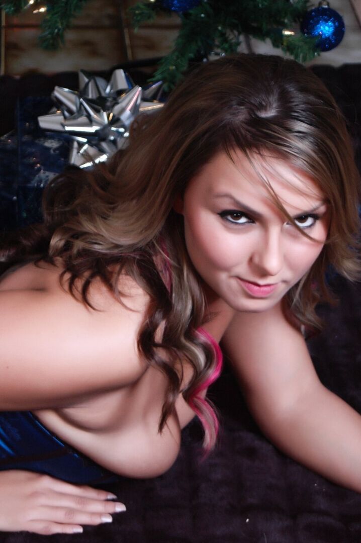 15P White chick removes her sexy lingerie in OTK nylons in front of the Xmas tree