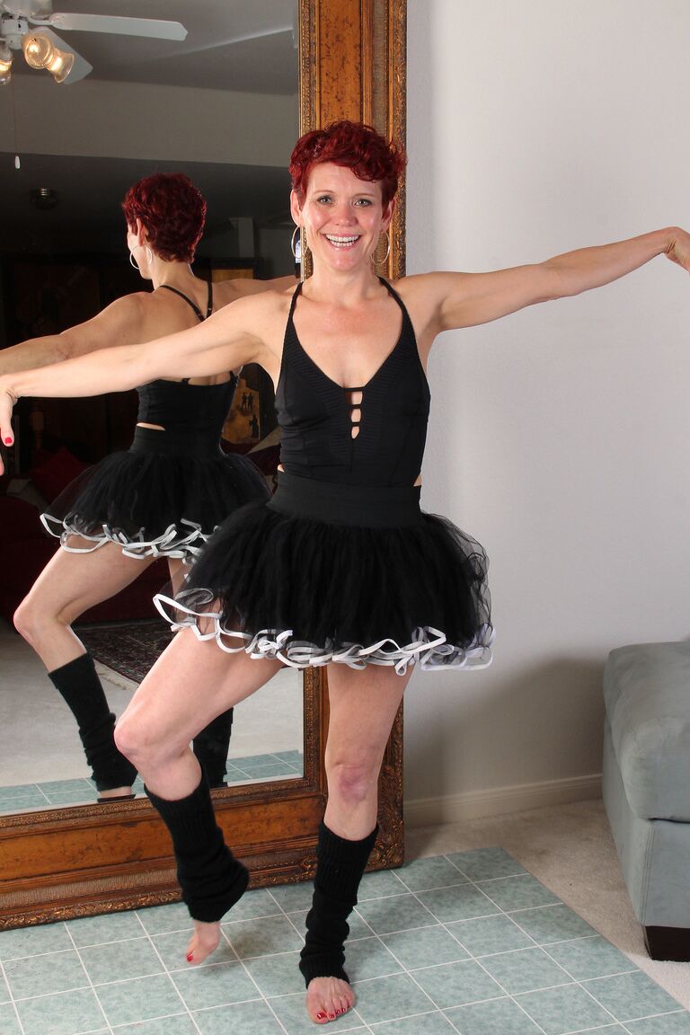 21P Mature redhead ballerina Suzy Stanton strips and masturbates on the floor