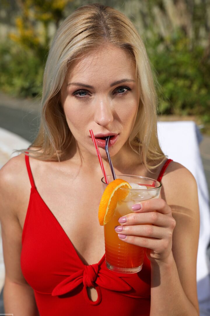 16P Blonde with great legs seduces a guy in red bathing suit and matching heels