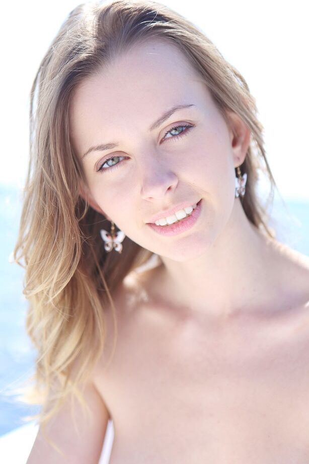 18P Tiny titted Lucia D on her knees spreading to show her hot pussy on the beach