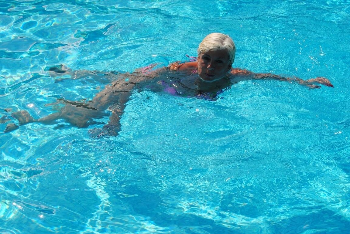 20P Older platinum blonde goes for a swim before showing her boobs by the road