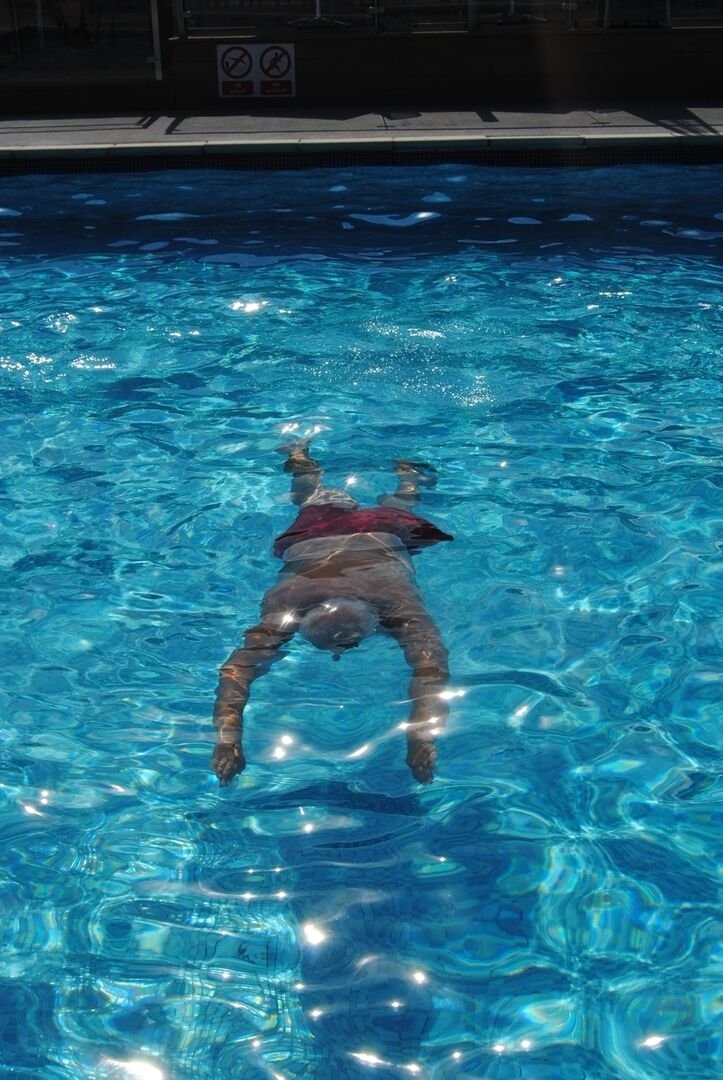 20P Older platinum blonde goes for a swim before showing her boobs by the road