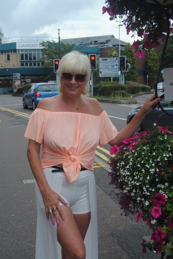 20P Older platinum blonde goes for a swim before showing her boobs by the road
