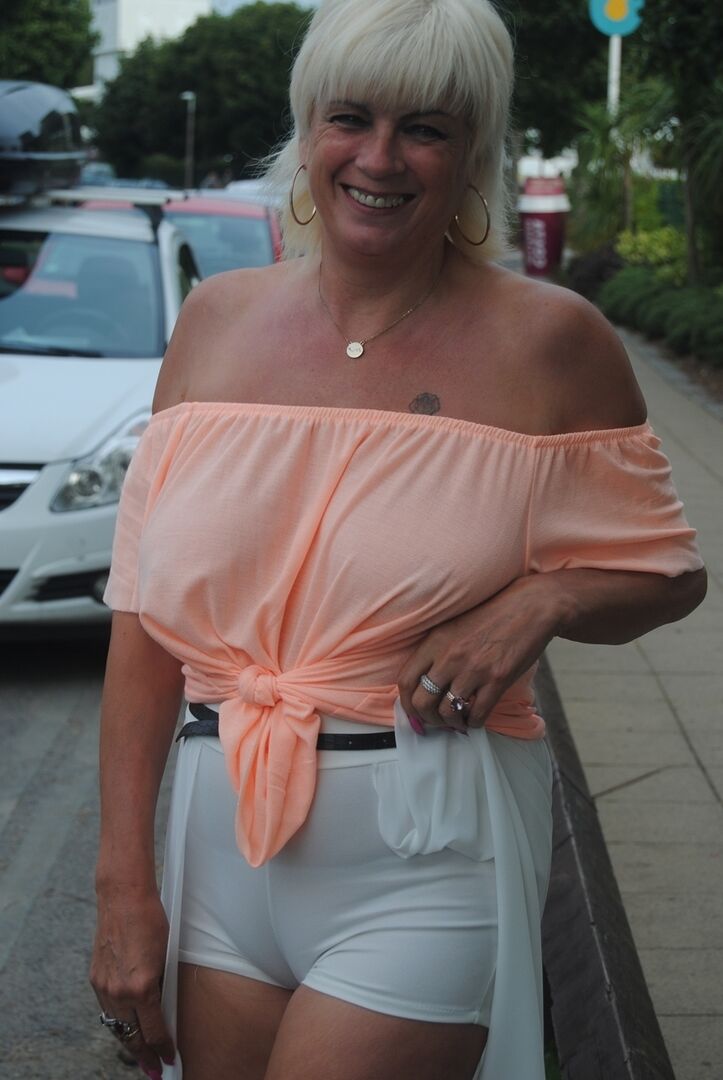 20P Older platinum blonde goes for a swim before showing her boobs by the road