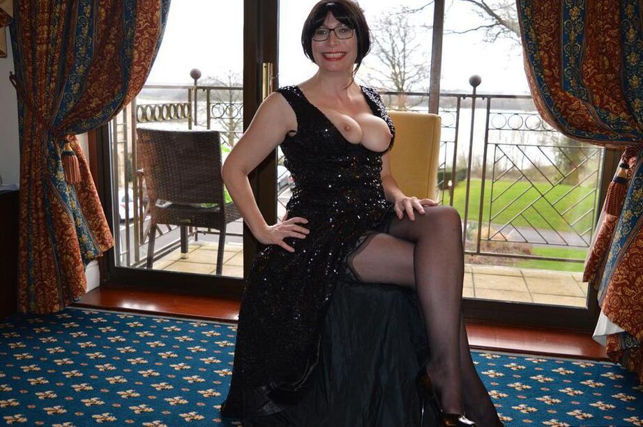20P Over 30 amateur Barby Slut slips off a long gown to pose nude in nylons