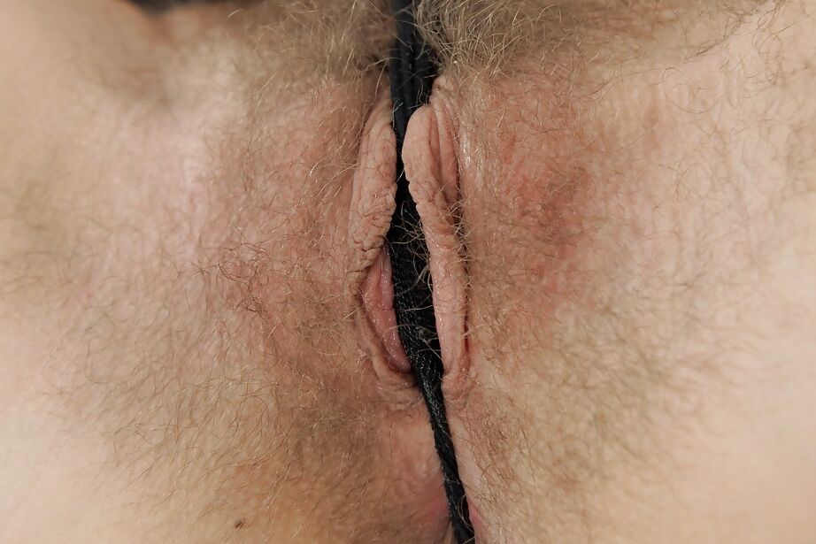 16P Euro model Promesita pulls down panties for close ups of hairy bush