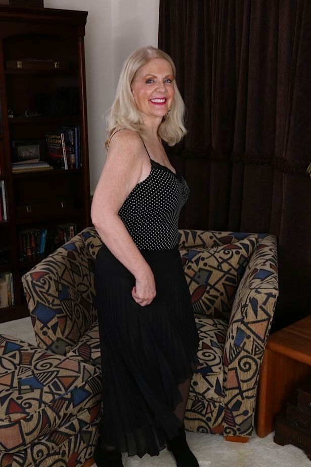 16P Clothed lady Judy Belkins pulling off nice pantyhose to reveal clitoris