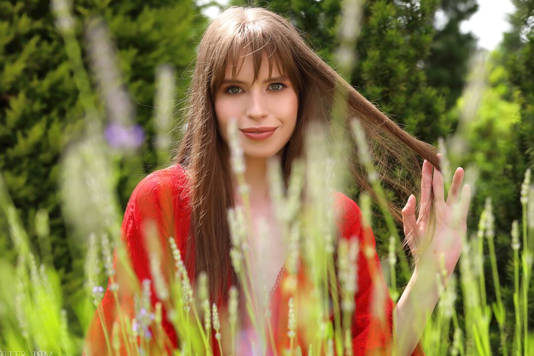 12P Beautiful girl gets completely naked while in a backyard garden setting
