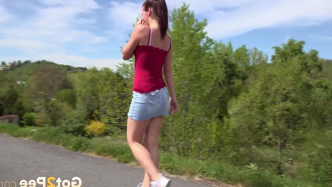 15P Caucasian girl Amanda Hill pisses on a paved roadway while out for a jog