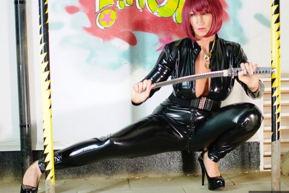 20P Amateur model Melody unzips a latex catsuit during solo action