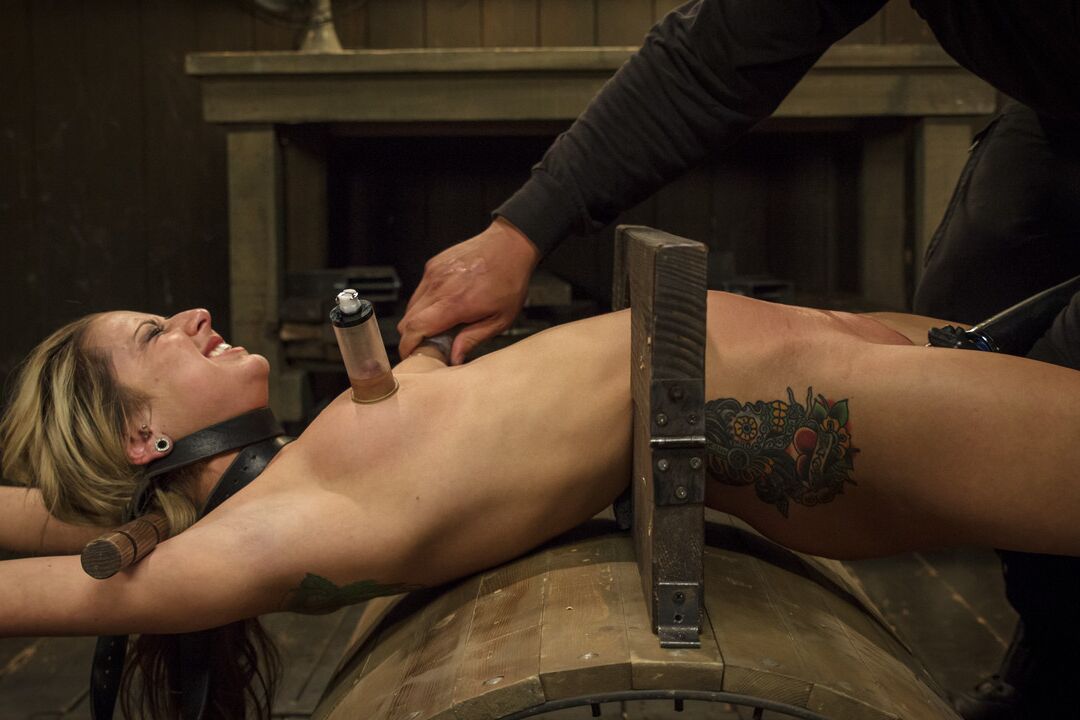 21P Submissive Dallas Blaze gets tortured while being tied to a metal construction