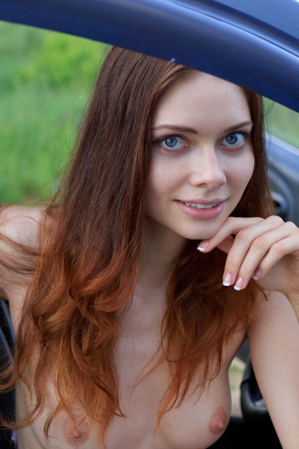 16P Natural redhead with long legs gets totally naked next water's edge