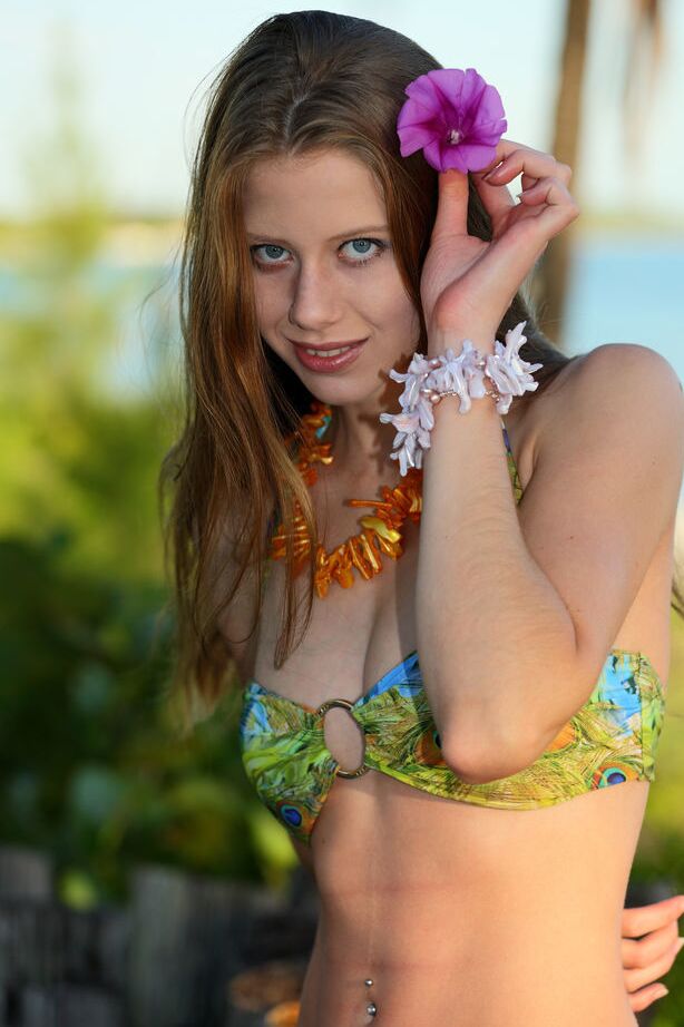 18P Wearing a matching tropical print bikini, Nicole K makes the perfect company