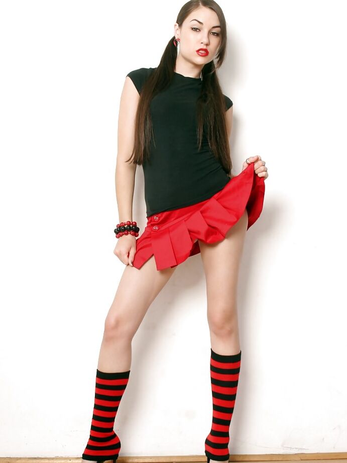 16P Slutty babe on high heels Sasha Grey stripping off her clothes