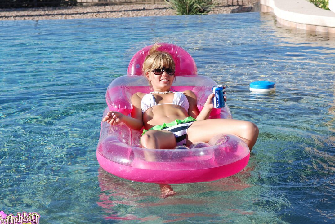 12P Young amateur Diddylicious takes off her bikini while in a swimming pool
