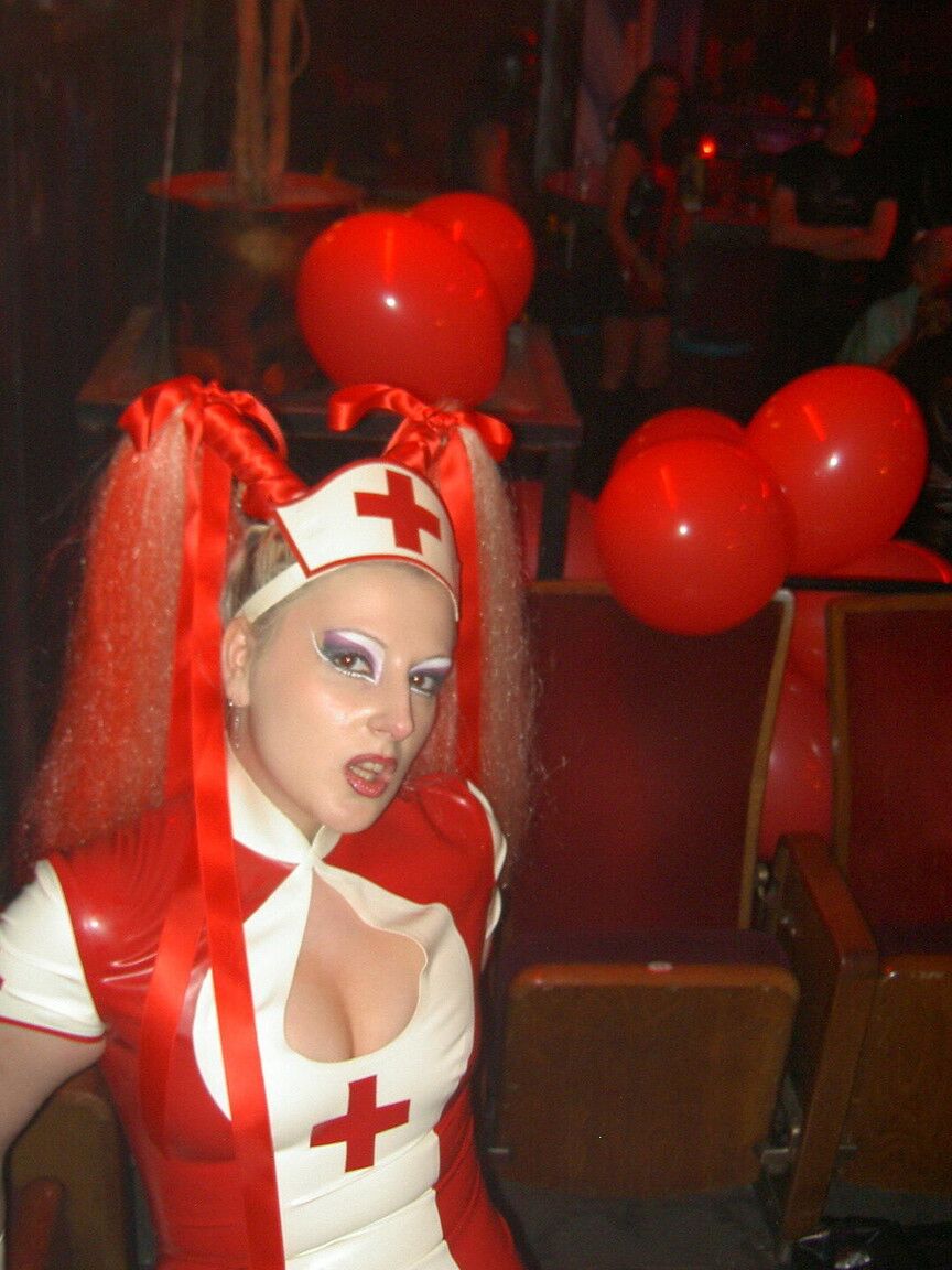 16P Latex attired nurse Joanne Lafontaine uses Darkwing Zero as her slave